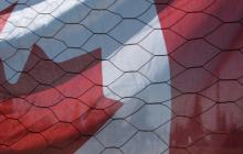 Canadian Flag Behind Chicken Wire