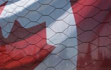 Canadian Flag Behind Chicken Wire