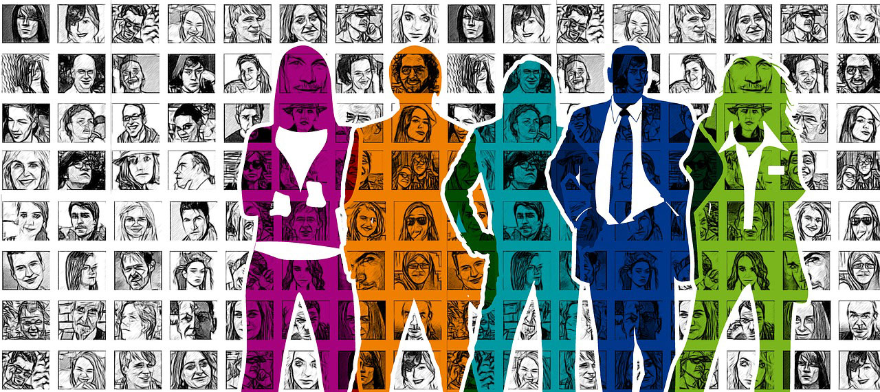 stylized silhouette of people standing in-front of a wall with images if diverse groups of people hanging on it